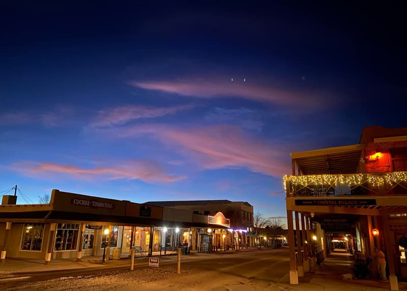 Allen Street in Tombstone at dusk with the Crystal Palace balcony lights on