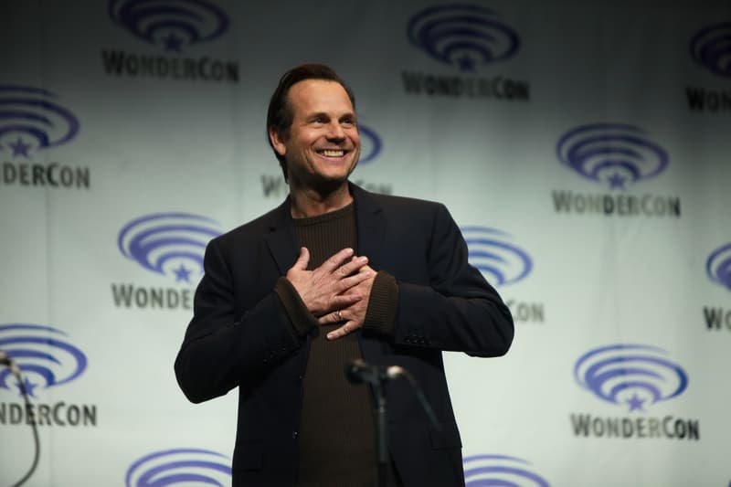 Bill Paxton speaking into a microphone on stage at WonderCon 2014